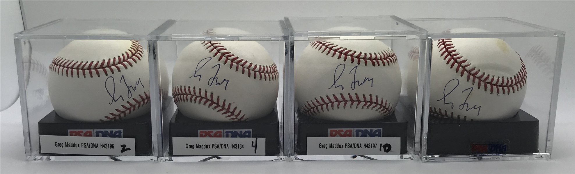 Lot of Four (4) Greg Maddux Signed OML Baseballs PSA/DNA Graded MINT+ 9.5!