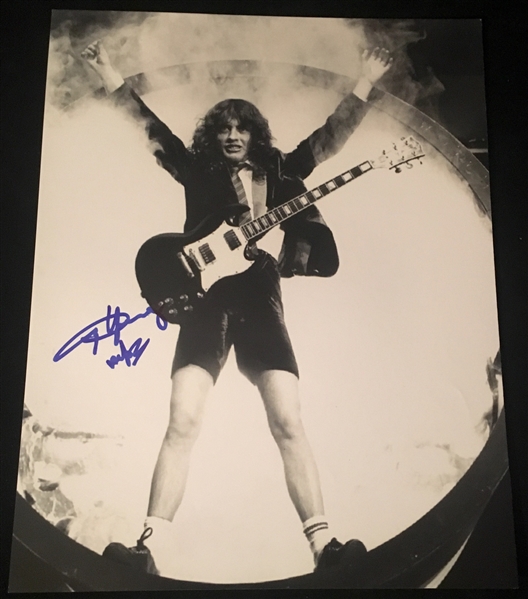 AC/DC: Angus Young Signed 11" x 14" Black & White On-Stage Photograph (Beckett/BAS Guaranteed)
