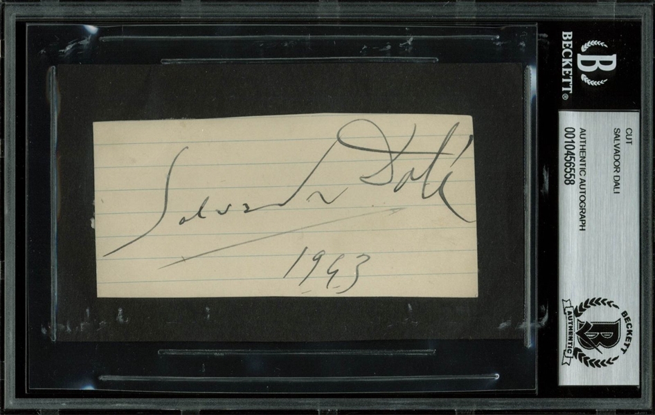 Salvador Dali Signed 1963 2" x 4" Rare Full Name Signature Cut (BAS/Beckett Encapsulated)