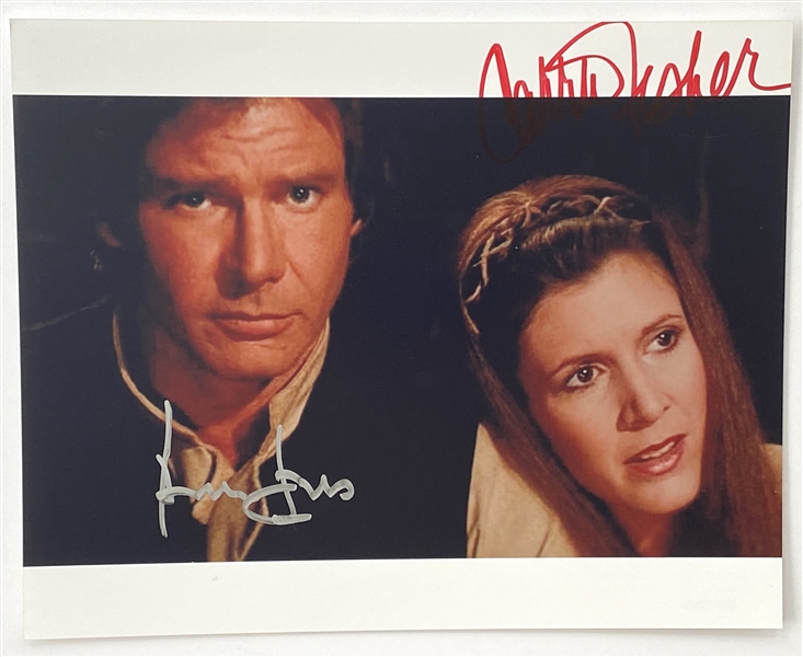 Star Wars: Harrison Ford and Carrie Fisher 10” x 8” Ewok Village Signed Photo from “Return of the Jedi” (Beckett/BAS Guaranteed)