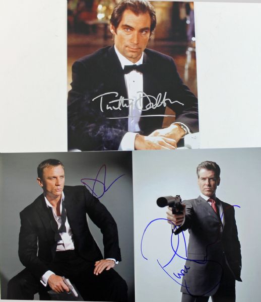 James Bond: Lot of Three (3) Signed 8" x 10" Color Photos with Brosnan, Craig & Dalton