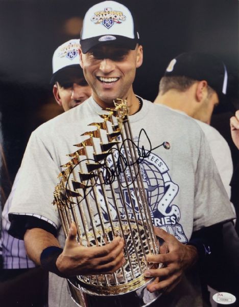 Derek Jeter Superb Signed 11" x 14" Color Photo with World Series Trophy (JSA)