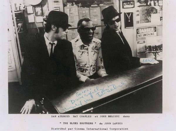 John Belushi Signed 8" x 10" Blues Brothers Photo w/ "Drive Carefully Stay Out of Jail" Inscription! (PSA/DNA)