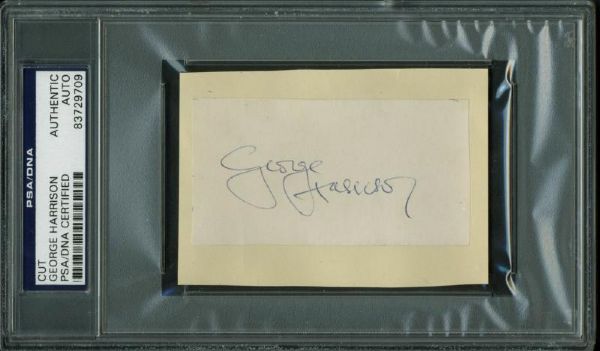 The Beatles: George Harrison Signed Signature Cut (PSA/DNA Encapsulated)