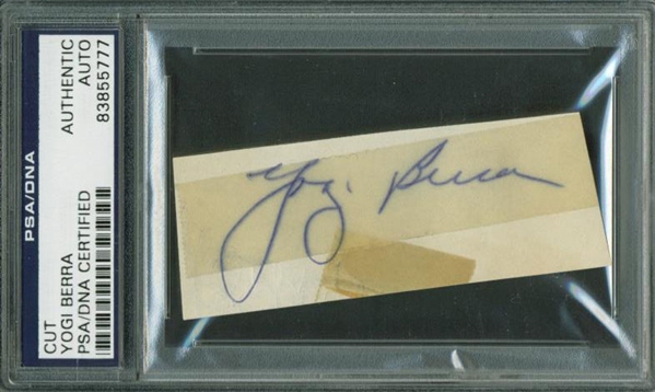 Yogi Berra Vintage Playing-Era Signed 1" x 3" Album Page (PSA/DNA Encapsulated)