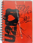 U2: Bono, The Edge, & Adam Clayton Signed Elevation Tour Book (PSA/DNA)