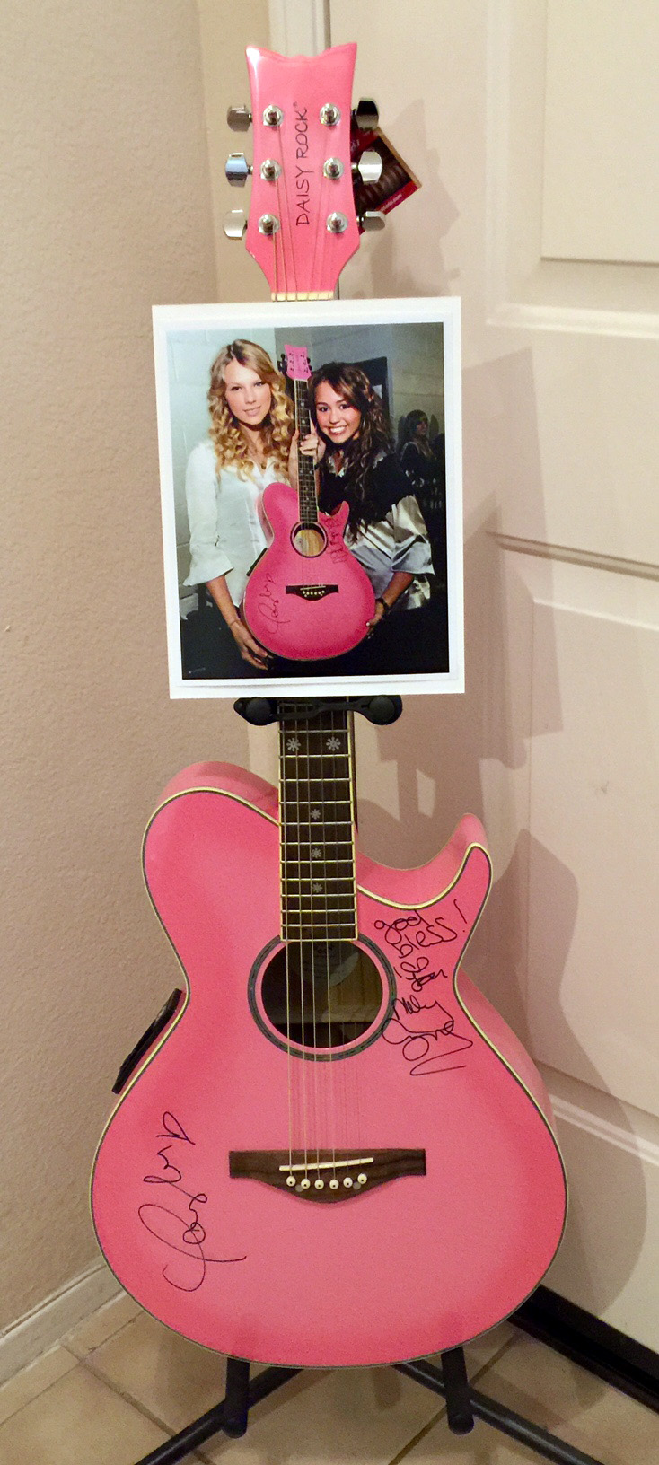 taylor swifts pink guitar