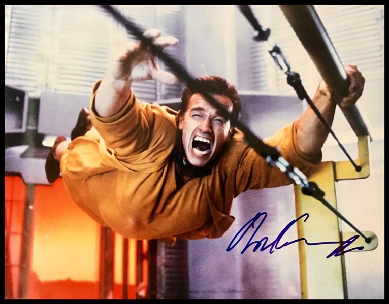 Arnold Schwarzenegger Signed 11" x 14" Photo from "Total Recall" (BAS/Beckett Guaranteed)