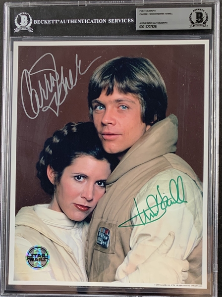 The Empire Strikes Back: Mark Hamill & Carrie Fisher Dual Signed 8" x 10" Color Photo (Official Pix)(Beckett/BAS Encapsulated)(Steve Grad Collection)