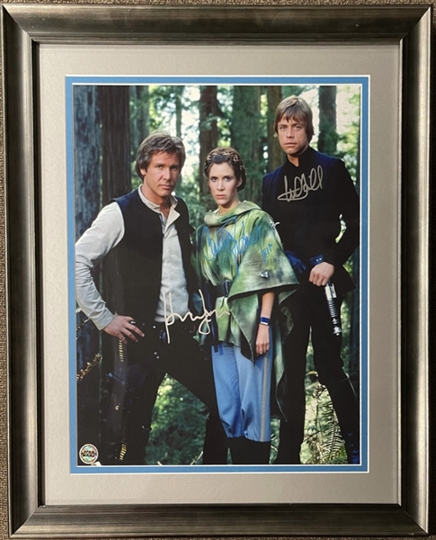 Star Wars: 16" x 20" Photo Signed by Mark Hamill, Carrie Fisher, and Harrison Ford (Beckett/BAS)