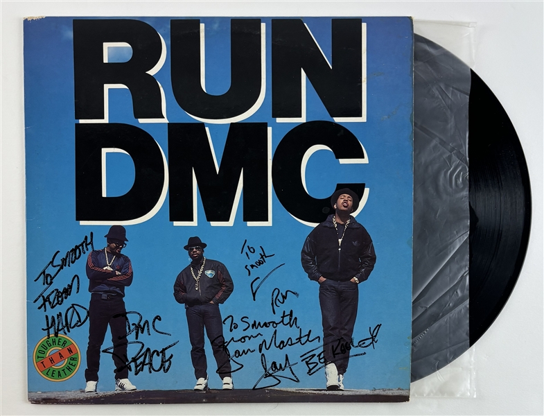 Run DMC : Group Signed "Tougher Than Leather" Album Cover w/ Vinyl (Beckett/BAS LOA)