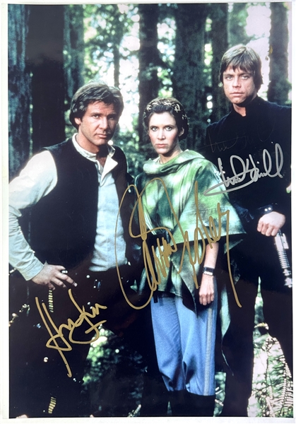 Star Wars Return of the Jedi: Harrison Ford, Carrie Fisher & Mark Hamill In-Person Signed 10" x 14" Color Photo (Beckett/BAS LOA)