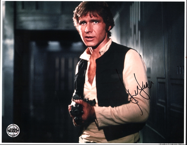 Star Wars: Harrison Ford Signed 11" x 14" Photo as Han Solo Holding Blaster (Beckett/BAS LOA)