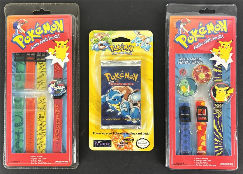 Lot of Two (2) Original Factory Sealed Innovative Time Pokemon Watches and a1999 Base Set Factory Sealed Hanger Pokemon Pack