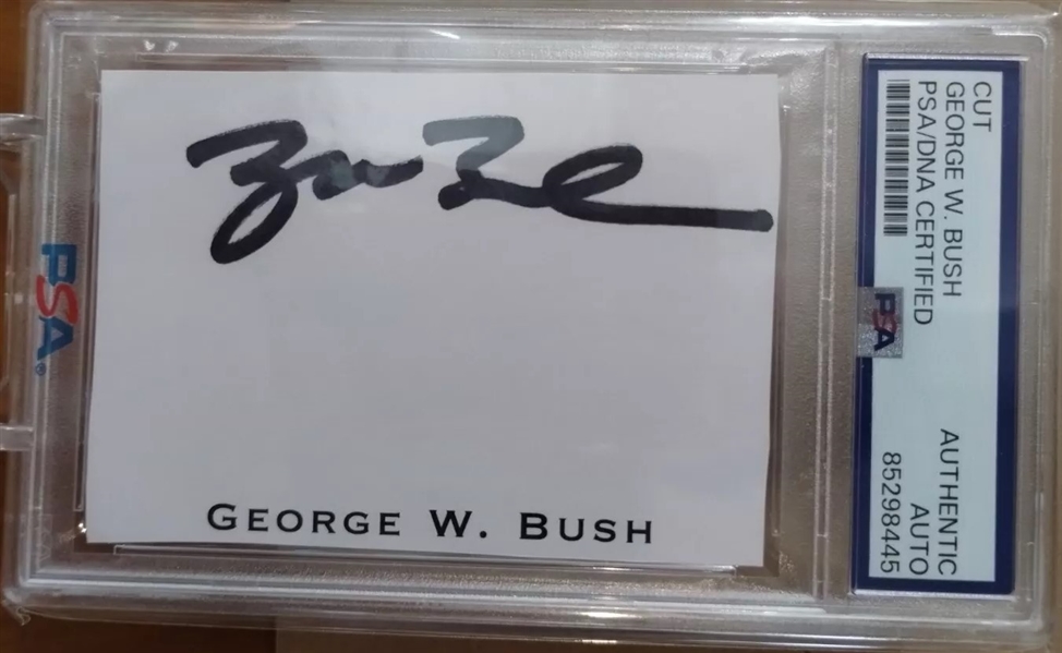 President George W. Bush Near-Mint Signed 2.5" x 3" Album Page (PSA/DNA Encapsulated)