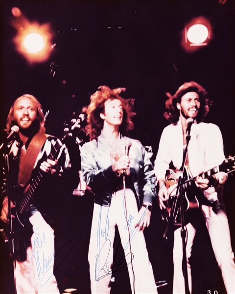 Bee Gees Vintage Group Signed 8" x 10" Original On-Stage Photograph w/ All Three Gibb Brothers! (PSA/DNA)