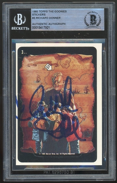 Goonies: Richard Donner Signed 1985 Topps #3 Sticker (Beckett/BAS Encapsulated)