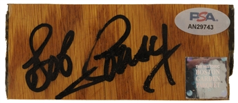 Bob Cousy Signed Original Game Used 1.75" x 3.75" Boston Garden Parquet Court (PSA/DNA)